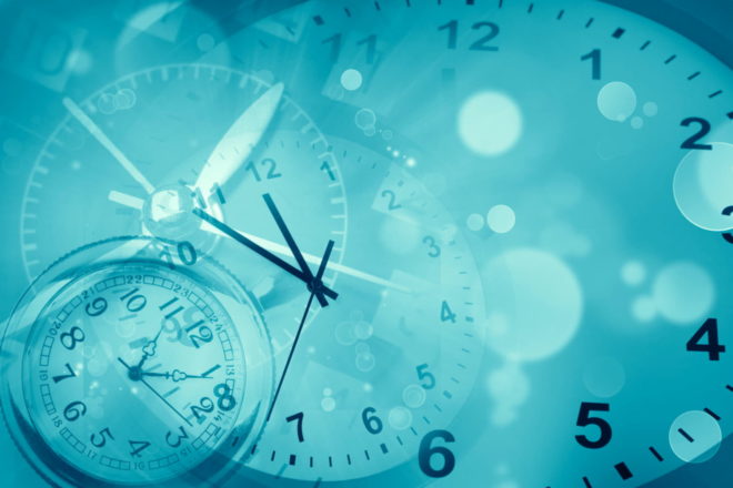 Clocks and abstract blue background